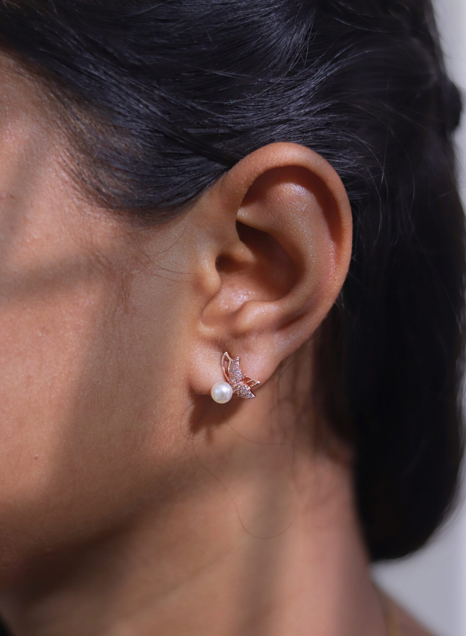 Butterfly Pearl Stud Earrings with Rose Gold Finish - Image 4